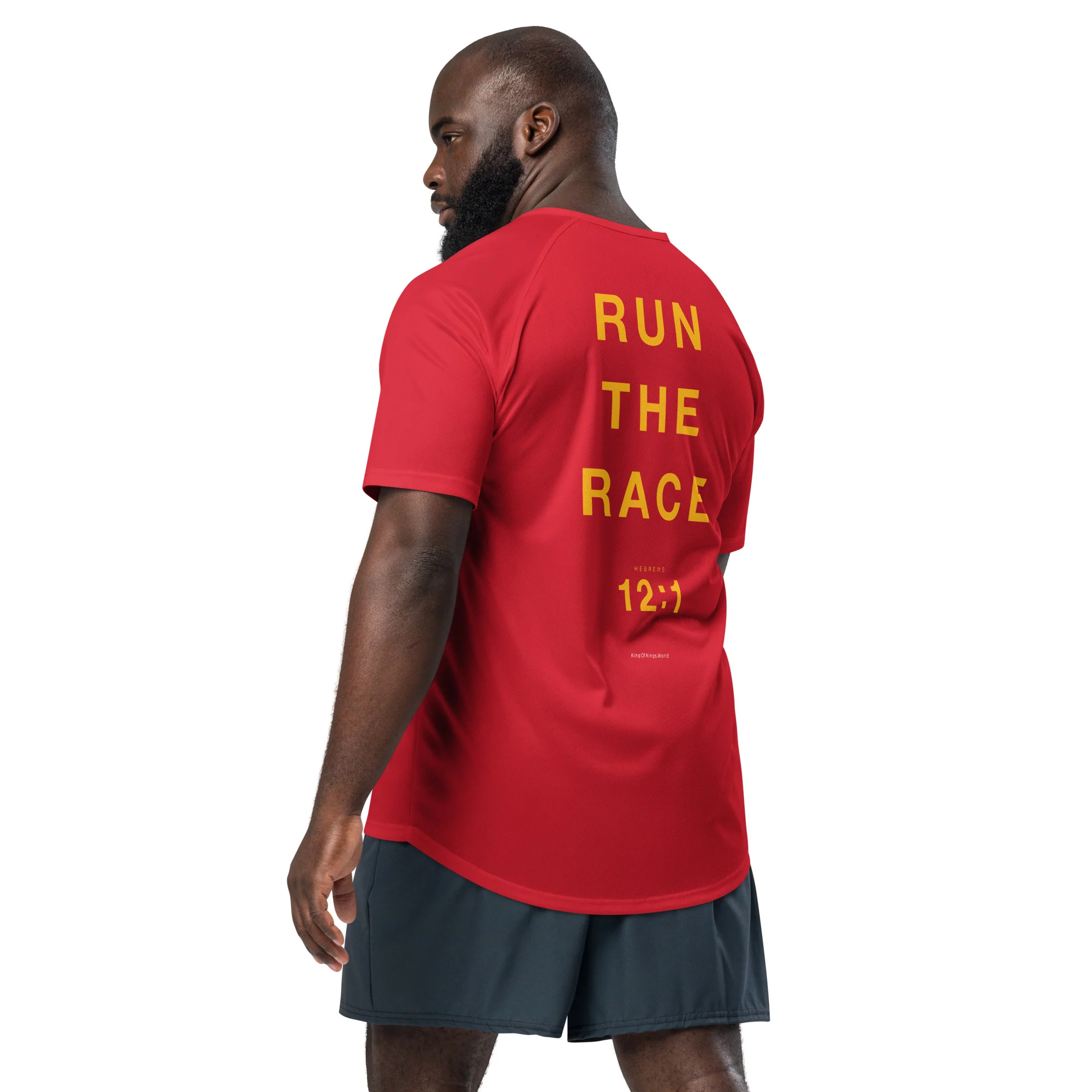 Runner photographed from behind wearing the red King of Kings “Run the Race” jersey with large gold lettering and a Hebrews 12:1 reference