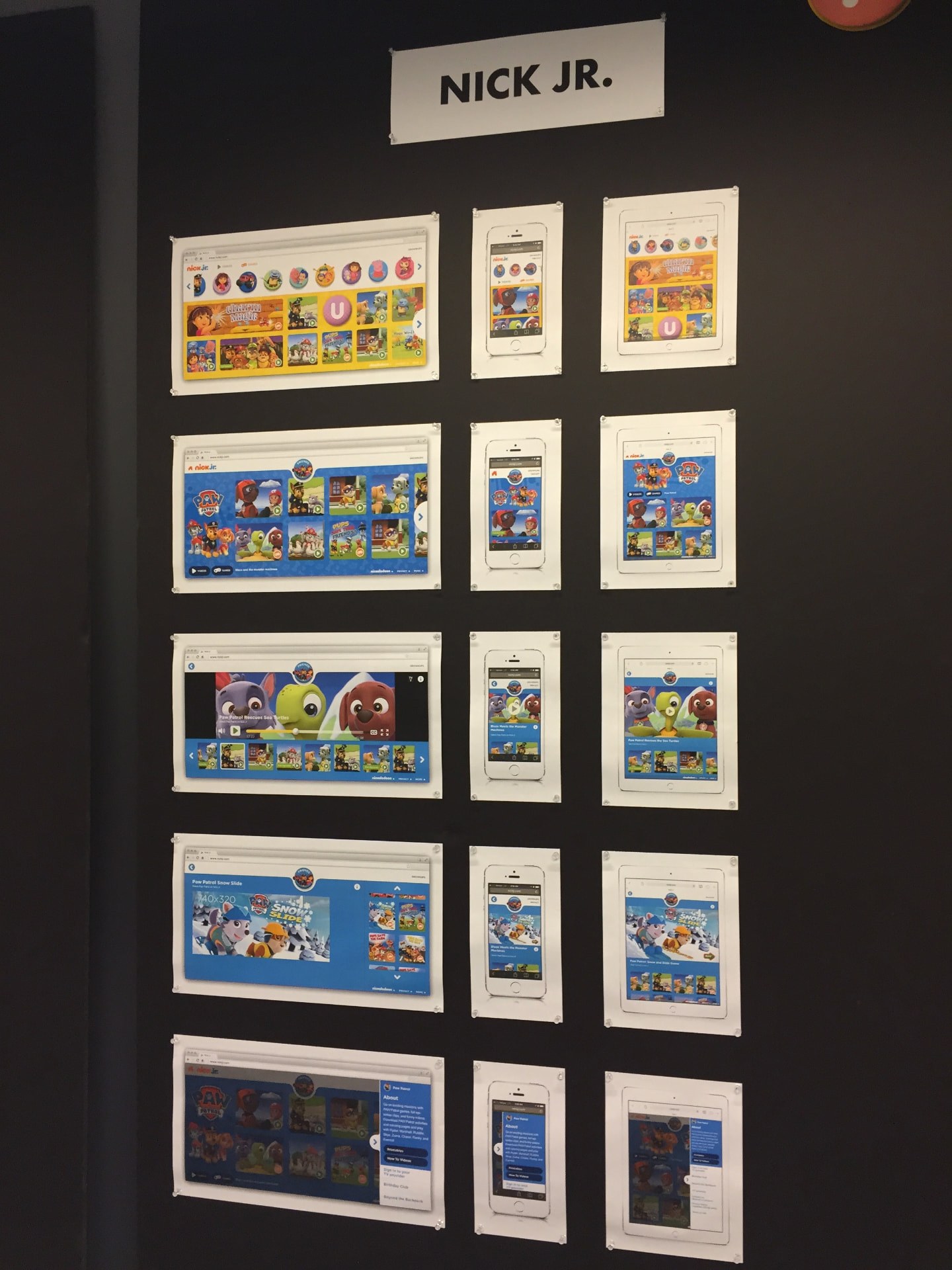 Nick Jr. design review wall — printed desktop, tablet and mobile screens