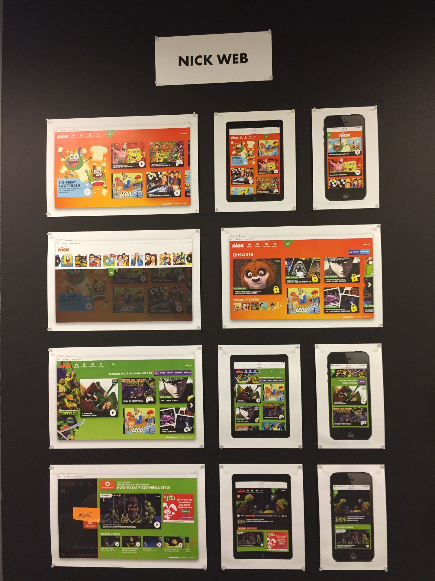 Nick Web design review wall — printed desktop, tablet and mobile screens