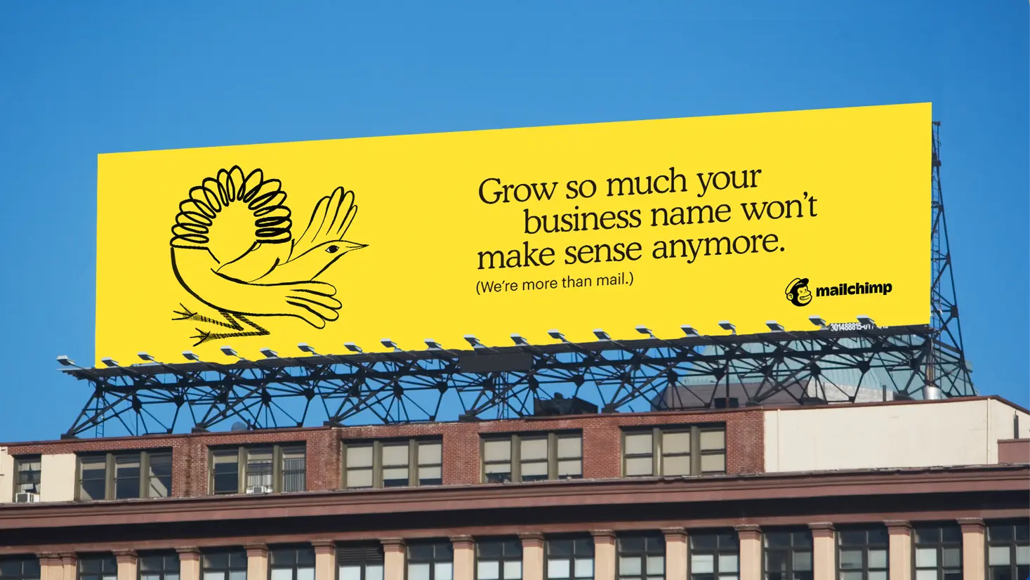 Mailchimp billboard with Freddie illustration and a business-growth message